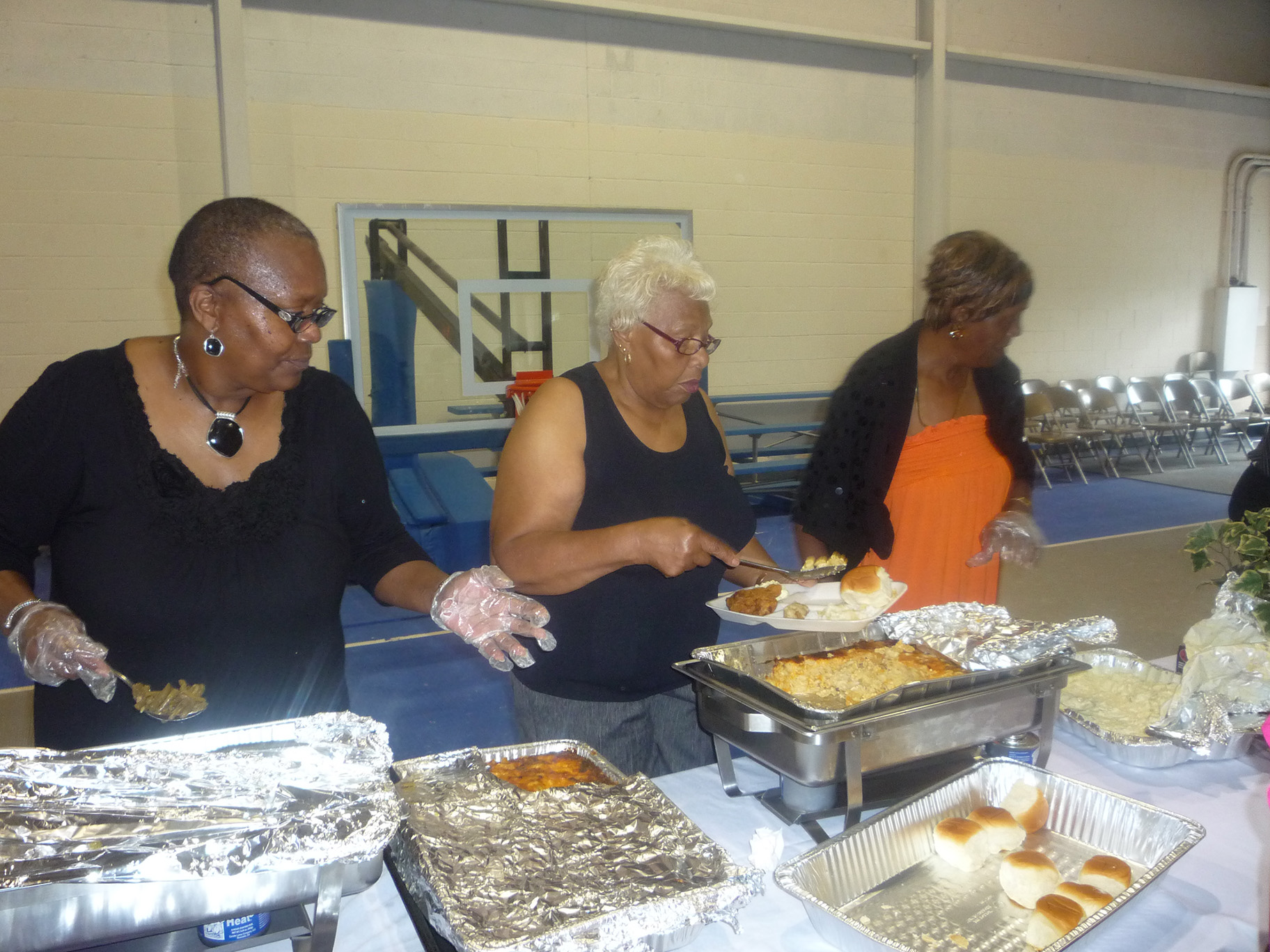 Ladies serving food at an event
